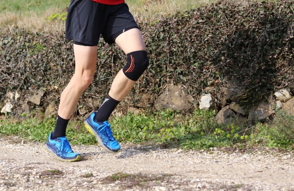 Sport injury treated by Hosford Health Clinic osteopath; cross country runner with knee brace